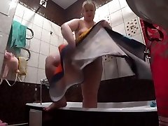 Lesbian has installed a hidden camera in the bathroom at his girlfriend. Peeping behind a alto nude wife with a big ass in the shower. Voyeur.
