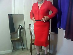 Dee wearing red skirt and blouse