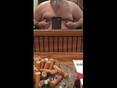 heavy smoker plays with huge moobs