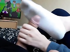 Sockjob sole slapping handjob for my boyfriend while we watch tv