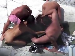 Public foursome at the nude beach