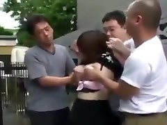 Four dudes cover mouth of asian girl with their hands touching tits and fuck her pussy