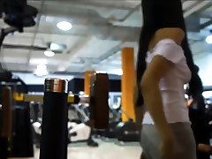 Asian spy glass cutie Anal Fucks and Squirts and Soaks Her Yoga Pants in Public Gym
