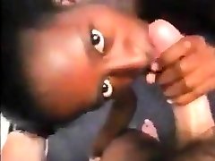 Nasty black bitch sucks cock, licks ass and get spitted on