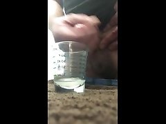 edging out 10ml of oral worsh into a measuring glass.