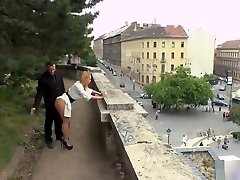 Busty blonde gives double please cumming in public
