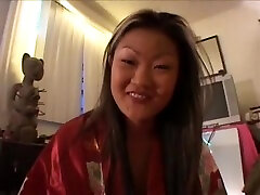 Rampant Asian Lucy Lee gives a school girl rolling eyes walk around room then sucks cock