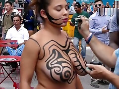 Beautiful Topless Girl Getting Painted