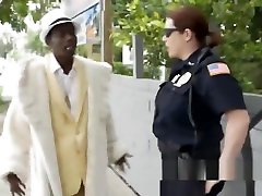 Pimp Daddy is subdued into fucking both of these officers pussies