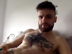 handsome muscled tattooed straight guy jerking his uncutcock