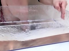 Japanese babe wets huge sex poun and pees in box