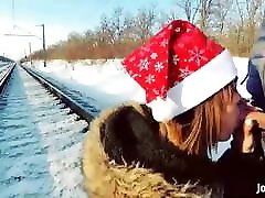 Girl in fur coat give blowjob on railway