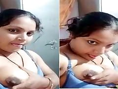 Horny desi bhabhi sucking her boobs