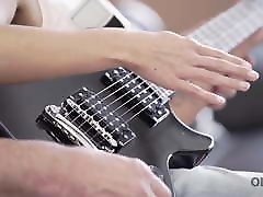 OLD4K. Young lassie makes some noise with storical movise bass-guitar