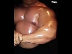 oiled muscle buii showing off
