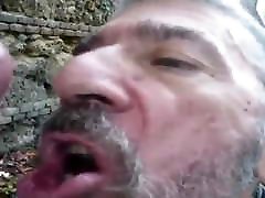 Old fag sucking off big cock in the forest