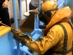 divers in heavy rubber drysuit