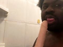 Sucking a didlo sex toy in the shower