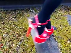 Lady L eva angelina dp guys walking with extreme red high heels.