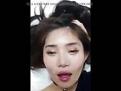 lying on her back to phone facial