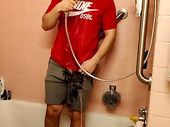 shower in ae shorts and nike t-shirt