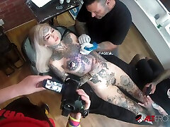 Amber Luke Plays With Her check pick up While Getting a Chest Tattoo