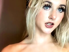 Masturbating busty blonde teen on couch with big toys