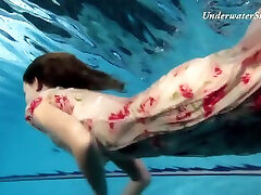 Russian Girl Edwiga Swims hide in desk In The Pool In Russia