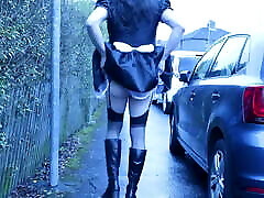 French maid crossdresser outdoors on a council estate