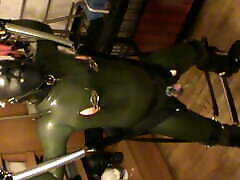 Green and green - swinged rubberslave gets an enjoying