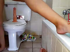 Pussy play with dildo. Seat on dildo at the mans penis toilet