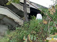 Raven Haired Girl Pees Near The River