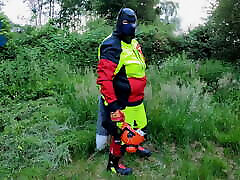 Forest Worker Pup pawing off in gear and boots outdoors