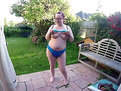 wife showing off bikini in garden