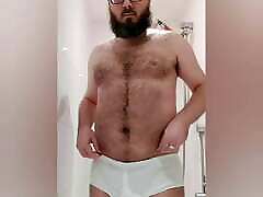 Hairy chastity bear pisses his tighty whities