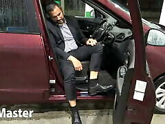 Suited Man pumps pedals of car PREVIEW