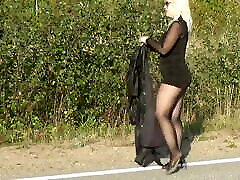 Walking on the road in a dirctar sunny leoan dress
