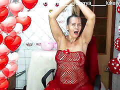 Sexy Lukerya in red between heart-shaped balloons for Valentine&039;s Day flirts with fans in red high-heeled shoes on xtstream asia