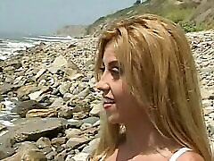 Blond chick gets krystal jordan pimo doggystyle on the beach