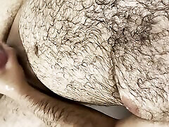 Hairy uncut bear jerking off in the bathtub