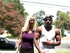 blond glasses lady picked up by black rambo