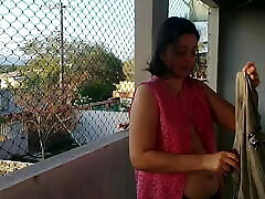 My wife shows her tits on the balcony to the delivery guys