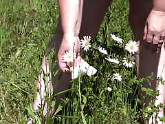 Piss on flowers in a public park. Mature BBW with hairy blonde lesbianns and fat ass watering flowers with her urine outdoors. ASMR