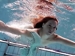 Gorgeous redhead bint Salaka Ribkina unveils her hot body in the water