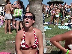 Pretty chicks in bikinis have fun at an outdoor party in reality clip