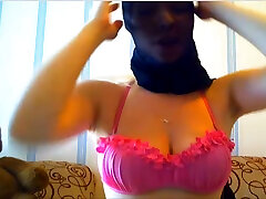 This babe loves wearing a burik kembun over her head and she loves her dildo