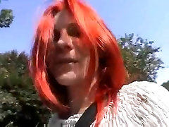 German Redhead masturbates and blows in a car