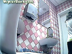 Lovely white lady in black pants and aline ufo pisses in the toilet