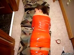 Weird Woman Wrapped In Orange Tape mayra gutierrez