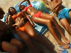 Having fun with these suntanned ladies on the beach